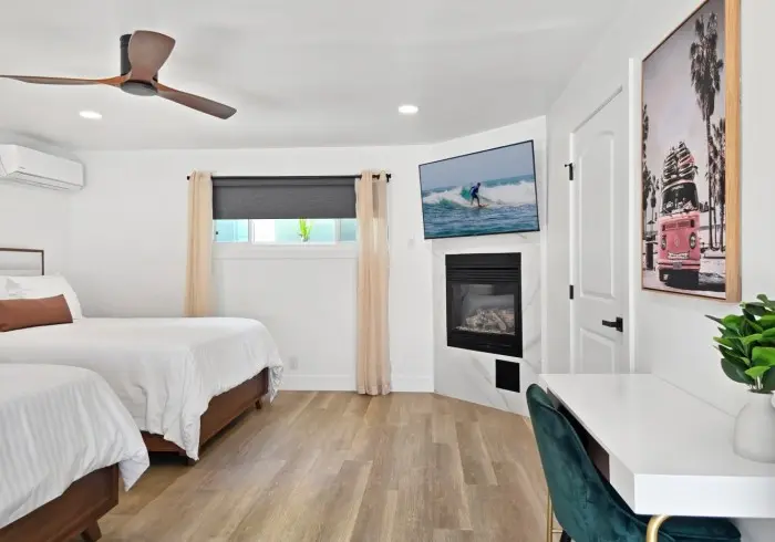 Living area and beds in Deluxe Queen suite.
