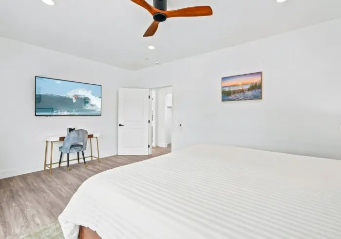 Bedroom view with bed and desk in Penthouse plus Studio.