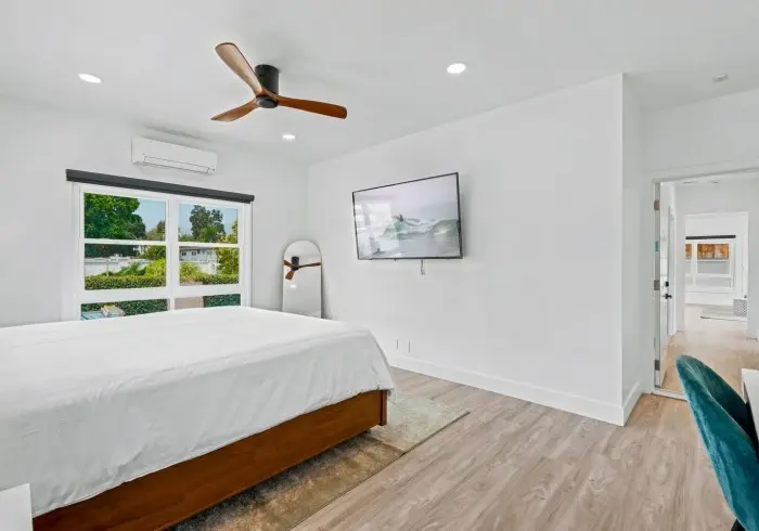 Bedroom featuring TV and ceiling fan in Penthouse plus Studio.