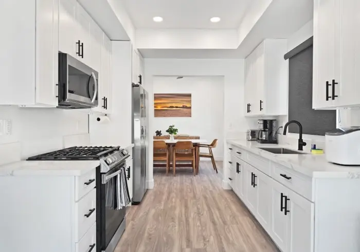 Kitchen corridor looking toward dining area in Penthouse plus Studio.