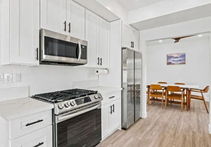 Gas stove and microwave in kitchen of Penthouse plus Studio.