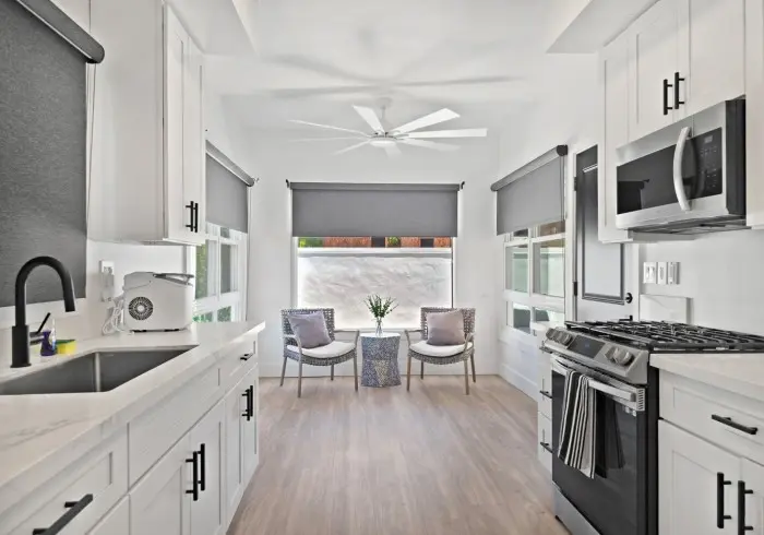 Full kitchen layout with window seating in Penthouse plus Studio.