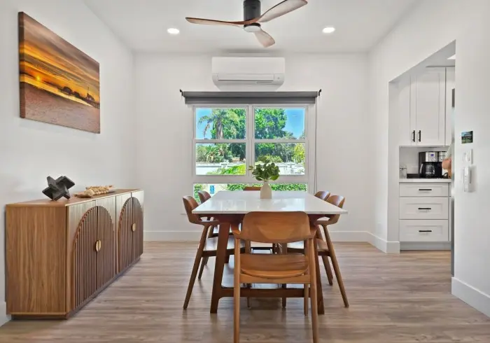 Wooden dining table and side console in Penthouse plus Studio.