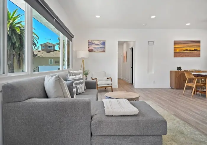 Living room sectional couch and open layout in Penthouse plus Studio.